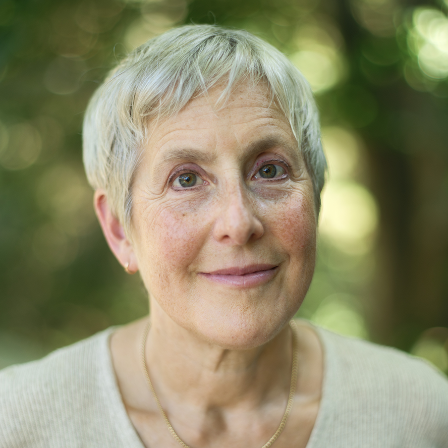 Headshot of Dr. Jody Lewen smiling against a nature background