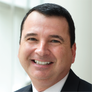 Headshot of Timothy Renick smiling