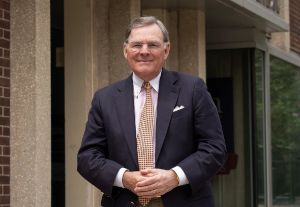 Terry McGraw standing outside of the Penn GSE building