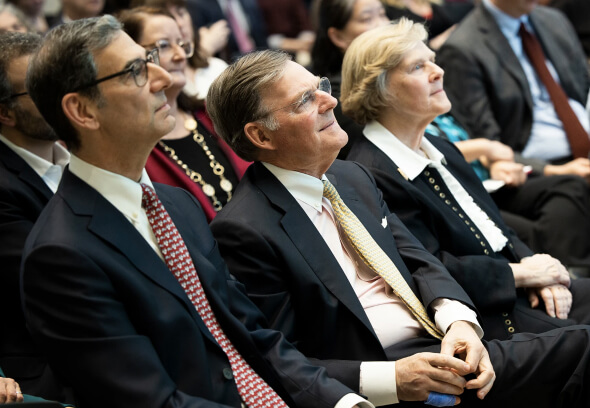 (Left to right) Catalyst @ Penn GSE Executive Director Michael Golden, Harold McGraw III, and Suzanne McGraw sitting in an audience watching a speaker off camera.